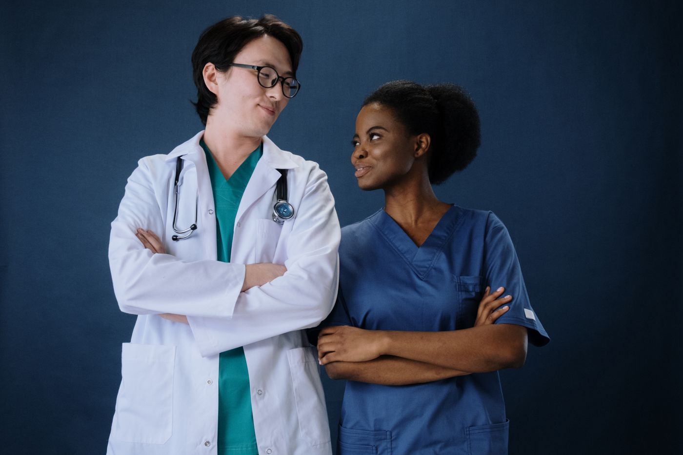 Physician and advanced practice provider standing together